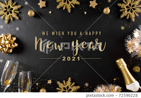 Christmas and New Year holidays background concept made from champagne, glasses, stars, snow flake with golden glitter on black wooden background. Christmas and New Year holidays background concept made from champagne, glasses, stars, snow flake with golden glitter on black wooden background. 72590228