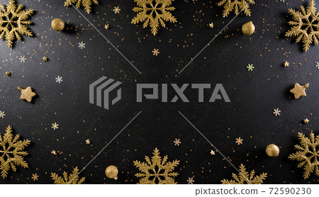 Christmas and New Year holidays background concept made from christmas ball, stars, snow flake with golden glitter on black wooden background. 72590230