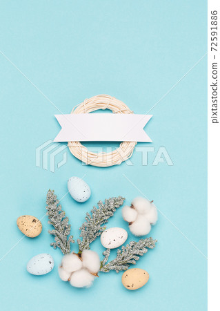Craft Easter eggs on blue pastel background, space for text. Flat lay image composition, top view. Craft Easter eggs on blue pastel background, space for text. Flat lay image composition, top view. 72591886