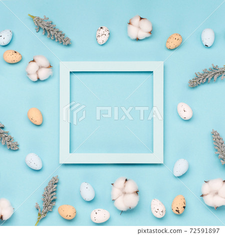 Craft Easter eggs on blue pastel background, space for text. Flat lay image composition, top view. Craft Easter eggs on blue pastel background, space for text. Flat lay image composition, top view. 72591897