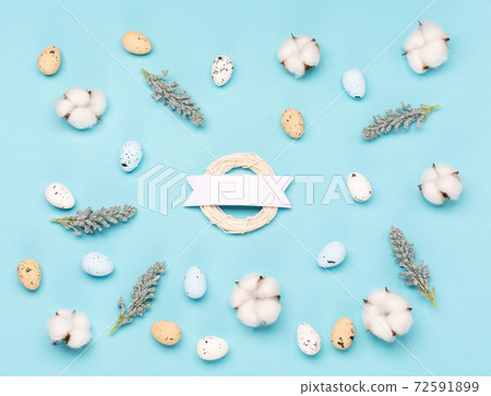 Craft Easter eggs on blue pastel background, space for text. Flat lay image composition, top view. Craft Easter eggs on blue pastel background, space for text. Flat lay image composition, top view. 72591899
