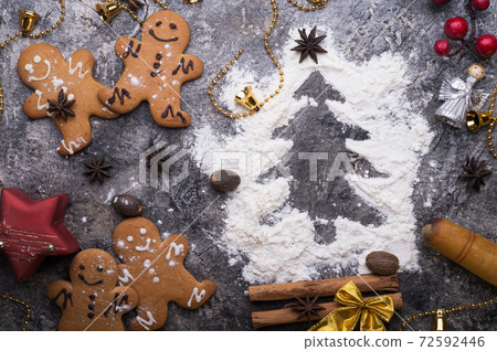 christmas decorative cookies with flour christmas tree. christmas background around grey background christmas decorative cookies with flour christmas tree. christmas background around grey background 72592446