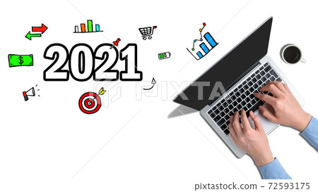 The concept of new achievements and ideas in 2021. Hands typed on a laptop with graphic icons next to it. The concept of new achievements and ideas in 2021. Hands typed on a laptop with graphic icons next to it. 72593175