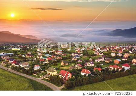 Beautiful sunrise in mountains with white fog below Beautiful sunrise in mountains with white fog below 72593225