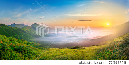 Idyllic landscape with green grass covered morning mountains Idyllic landscape with green grass covered morning mountains 72593226