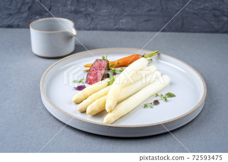 barbecue dry aged sliced filet steak with white asparagus and sauce hollandaise barbecue dry aged sliced filet steak with white asparagus and sauce hollandaise 72593475