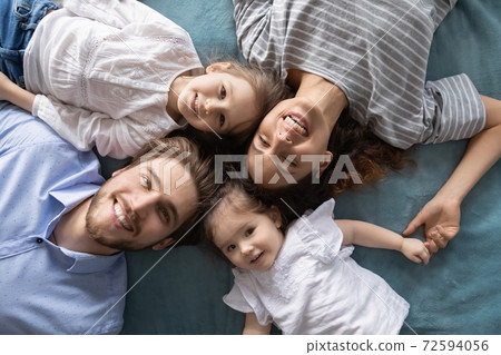 Top view portrait of happy family with kids resting Top view portrait of happy family with kids resting 72594056