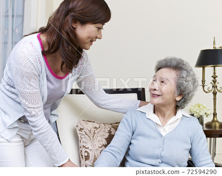 senior asian woman and her adult daughter 72594290