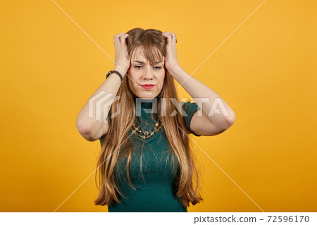 Headache grimacing pain holds the back of neck indicating location. Fatigue 72596170