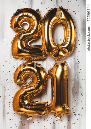 Happy New year 2021 celebration. Bright gold balloons figures New Year Balloons with glitter stars on white background. Christmas and new year celebration. Gold foil balloons numeral 2021 and confetti Happy New year 2021 celebration. Bright gold balloons figures New Year Balloons with glitter stars on white background. Christmas and new year celebration. Gold foil balloons numeral 2021 and confetti 72596544