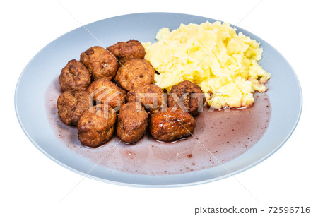 cooked meatballs nd mashed potatoes on blue plate cooked meatballs nd mashed potatoes on blue plate 72596716