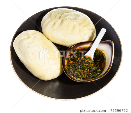 portion of cooked Wang Mandu Pyanse on plate portion of cooked Wang Mandu Pyanse on plate 72596722
