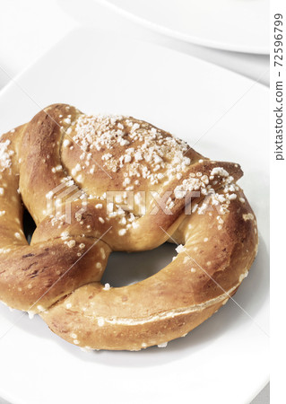 vegan dairy-free organic german pretzel bread on white table 72596799