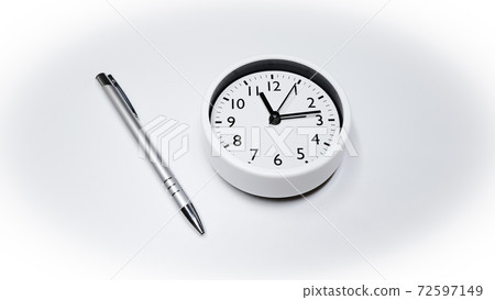 Image of clock and ballpoint pen Image of clock and ballpoint pen 72597149