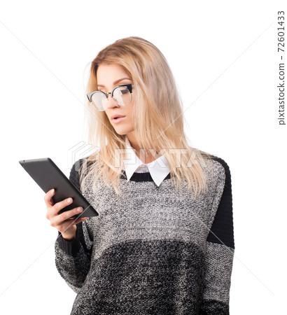 Business woman in glasses checking her tablet, isolated on white Business woman in glasses checking her tablet, isolated on white 72601433