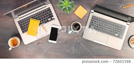 two laptops on desk for remote working or studying top view 72601598