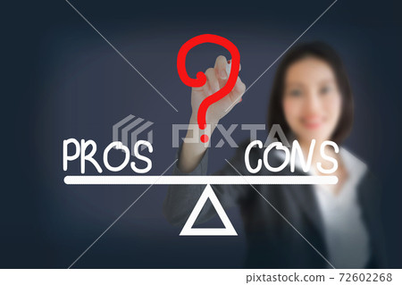 businesswoman writing  pros and cons compare on balance bar 72602268