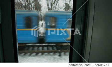 Close up train in motion outdoors. Close up train in motion outdoors. 72603745