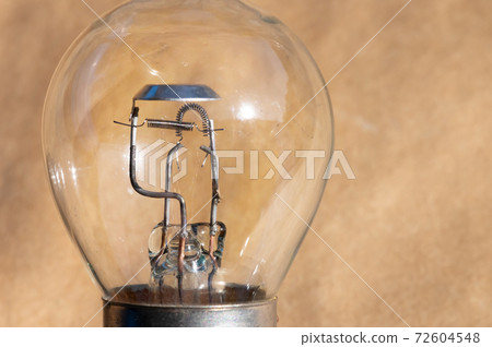 Close-up of filament H4 halogen car bulb. 72604548
