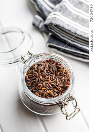 Uncooked red rice. Raw wild rice. Uncooked red rice. Raw wild rice. 72604789
