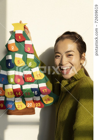 Woman preparing for Christmas Woman preparing for Christmas 72609619