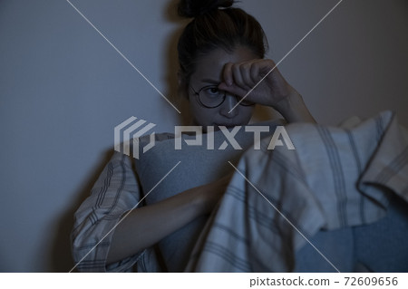 Woman watching a movie in the room Woman watching a movie in the room 72609656