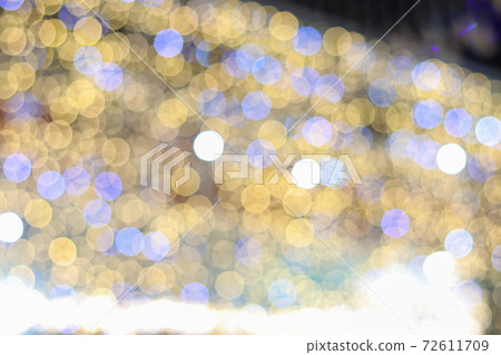 Abstract blur bokeh background with Christmas festive lights yellow and blue defocused illumination background 72611709