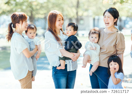 Mom friends and kids playing in the park 72611717