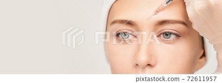 Near eye injection at spa salon. Doctor hands. Closeup. High quality Near eye injection at spa salon. Doctor hands. Closeup. High quality 72611957