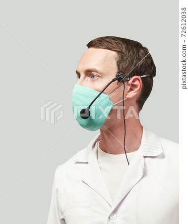 Male doctor with headphones. Studio Medicine portrait. 72612038