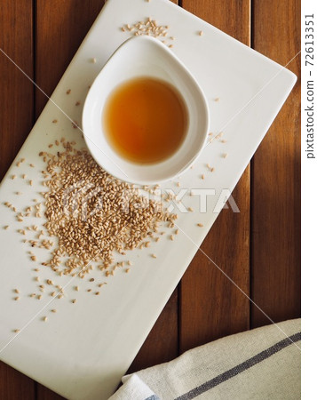 Sesame oil and sesame seeds, traditional Asian food 72613351