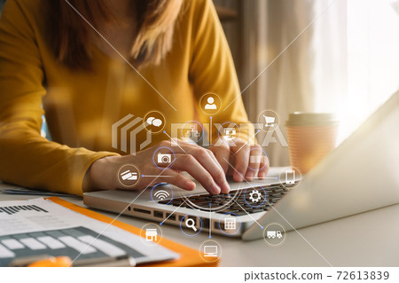 Business documents on office desk with laptop and graph business diagram and woman working at office. Business documents on office desk with laptop and graph business diagram and woman working at office. 72613839