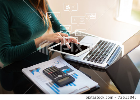 Businesswomen working with laptop and digital tablet computer in office with digital marketing media in virtual icon. Businesswomen working with laptop and digital tablet computer in office with digital marketing media in virtual icon. 72613843