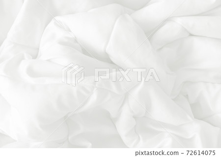 Close up top view of white bedding sheet and wrinkle messy blanket in bedroom after wake up in the morning. Close up top view of white bedding sheet and wrinkle messy blanket in bedroom after wake up in the morning. 72614075