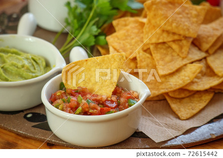 Tortilla chips and salsa sauce Tortilla chips and salsa sauce 72615442