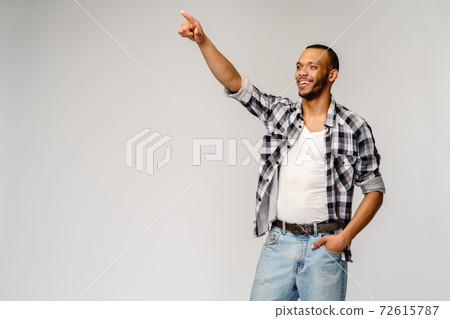 Young african american man pressing or pushing button on virtual screen 72615787