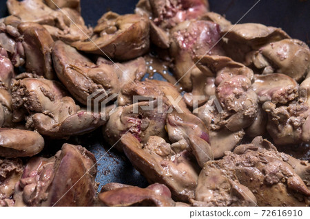 Cooking fried liver in a frying pan close-up. selective focus 72616910