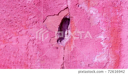 pink color of a concrete wall crack, the destruction of the wall texture background. banner 72616942