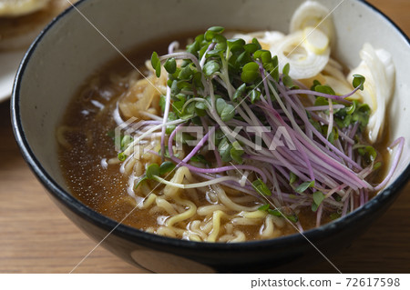 Miso ramen with plenty of white sesame seeds with red radish sprout 72617598