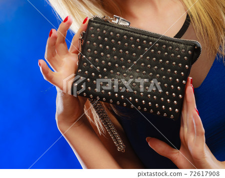 Evening handbag in woman hand 72617908