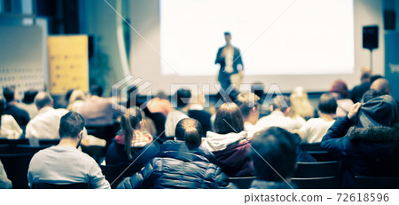 Business speaker giving a talk at business conference event. 72618596