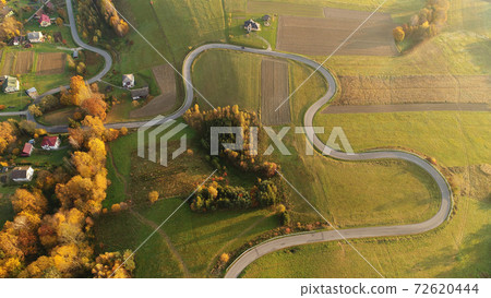 Road in autumn scenery - aerial shot Road in autumn scenery - aerial shot 72620444