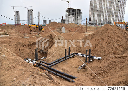 Laying water pipes with insulation of the central heating systems in the ground. Laying water pipes with insulation of the central heating systems in the ground. 72621356