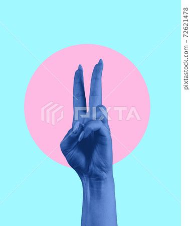 Contemporary art collage. Blue human hand showing victory sign. 72621478