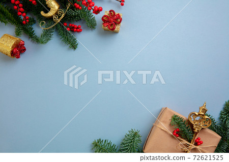 Holiday decorations on blue background top view. Christmas greeting card 72621525
