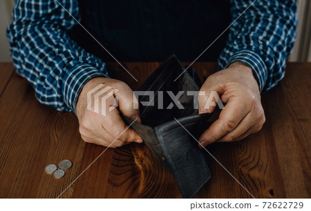 Close up of senior man wihout money and an empty wallet, economic crisis concept Close up of senior man wihout money and an empty wallet, economic crisis concept 72622729