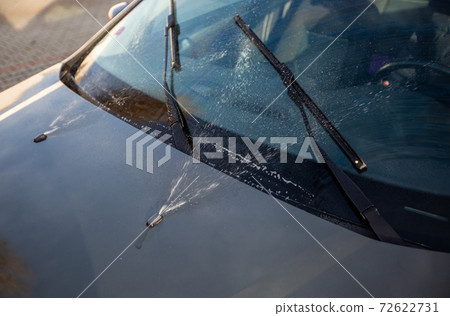 Close up of a car windshield washers Close up of a car windshield washers 72622731