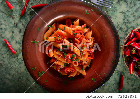 Penne pasta with chili sauce arrabiata 72625851