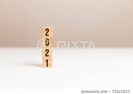 Wooden cubes block with 2021 text on table background. Way, quick solution, idea, imagination, concept, building, business, create concept Wooden cubes block with 2021 text on table background. Way, quick solution, idea, imagination, concept, building, business, create concept 72625855