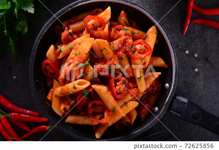 Penne pasta with chili sauce arrabiata Penne pasta with chili sauce arrabiata 72625856